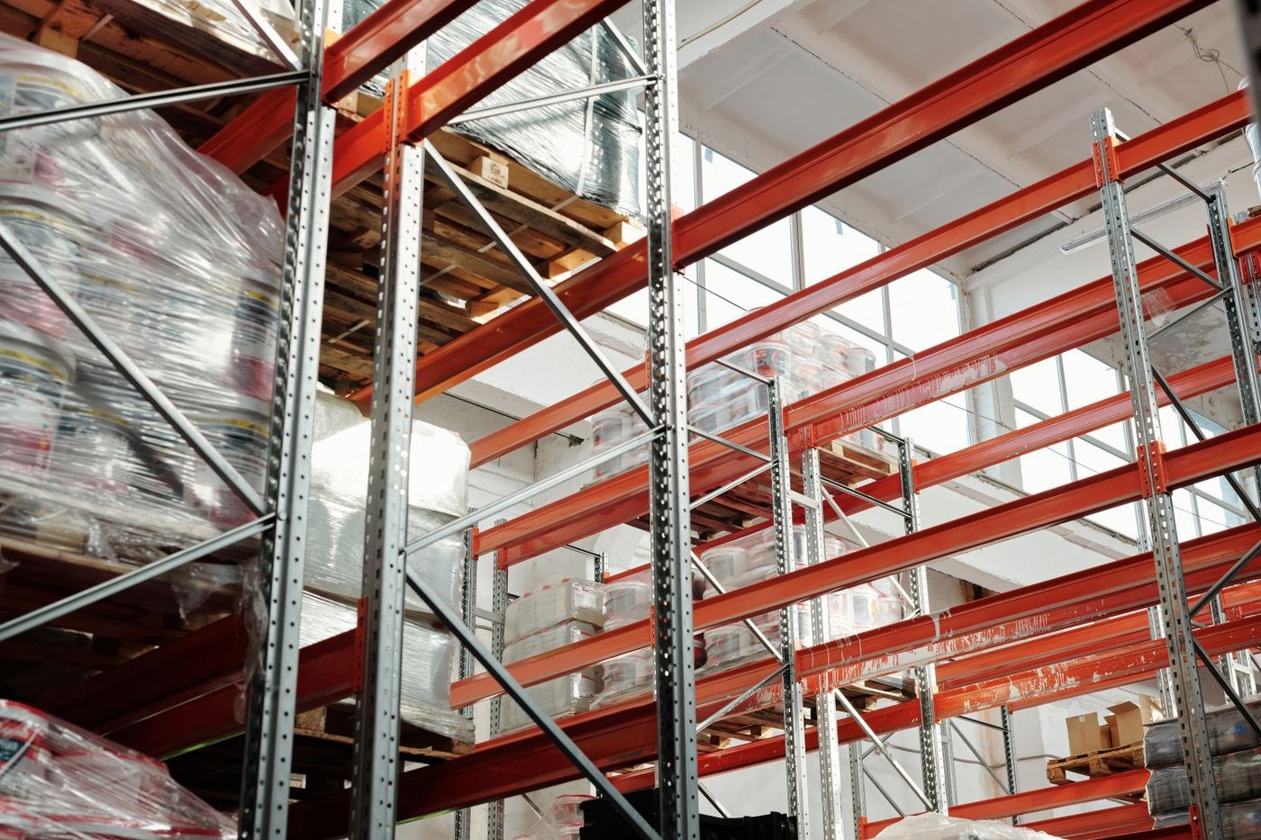 Wrapped palletized goods stored on warehouse racks