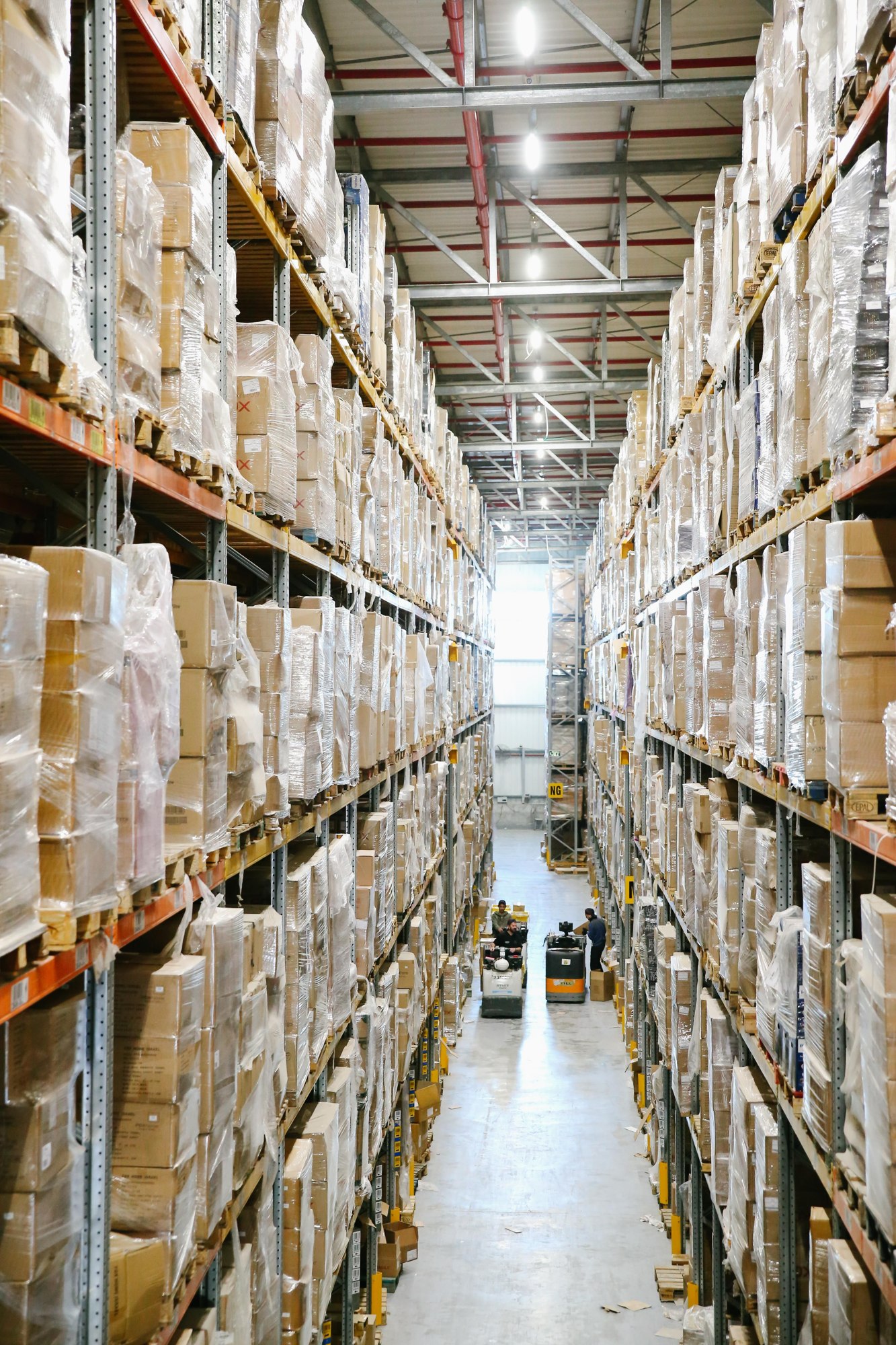 Tall warehouse storage racks lining an aisle